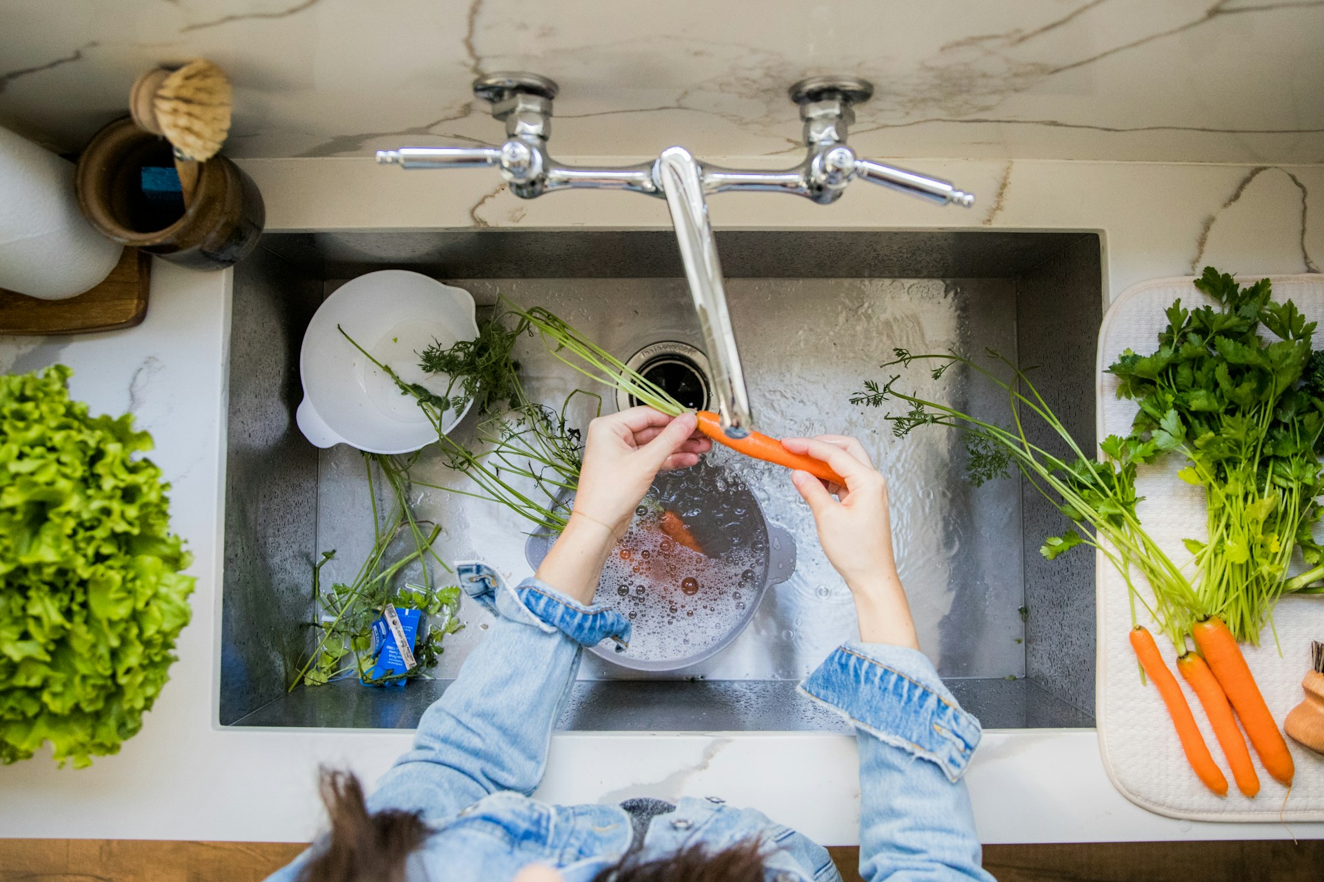 washing vegetables in the sink